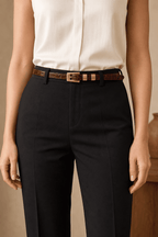 Woman wearing a brown croc-embossed belt