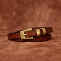 Brown women's belt, tip detail