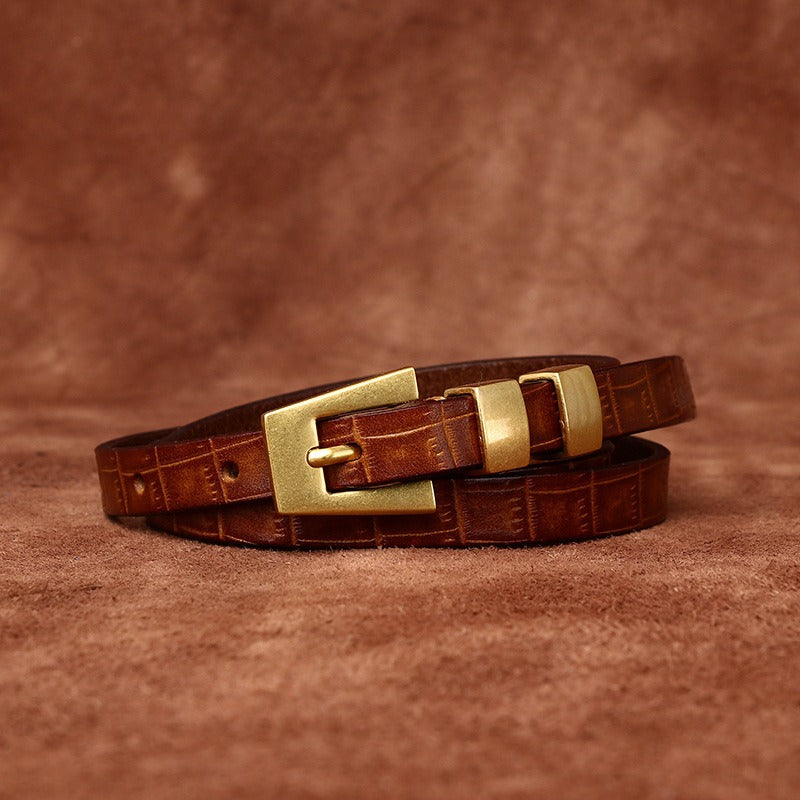 Brown women's belt, tip detail