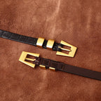 Brown women's belt, coiled view