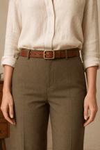 Woman wearing a red brown stitched belt