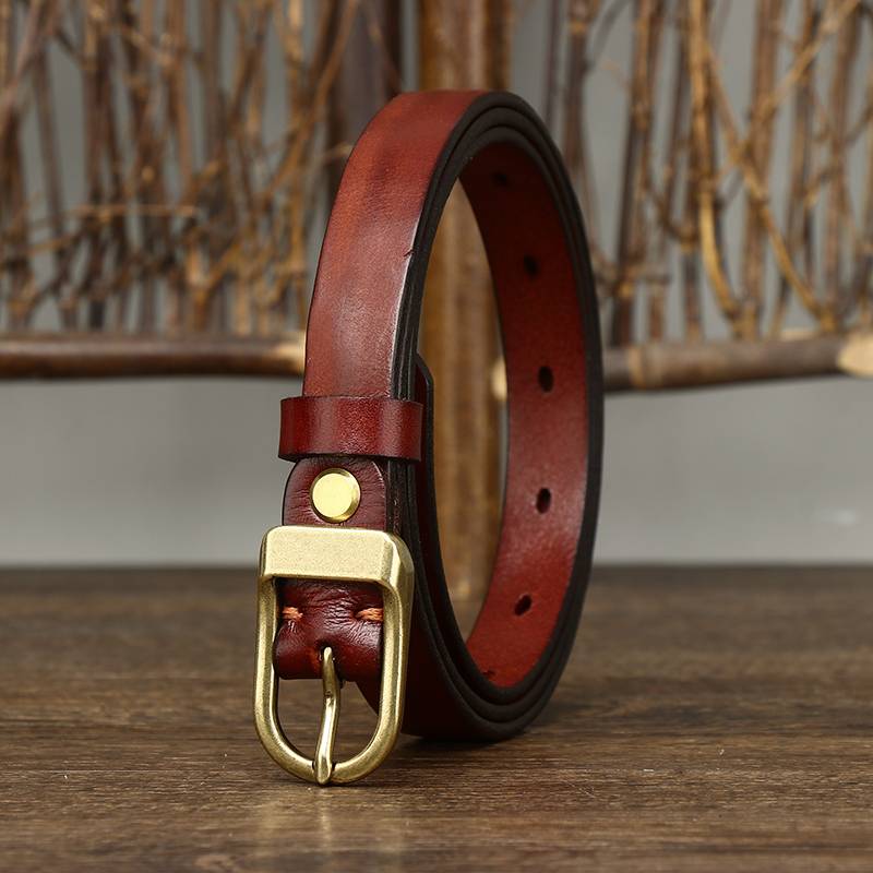 Red women's belt, coiled view