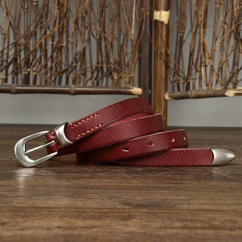 Red women's belt, coiled view