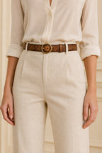 Brown women's vintage round buckle leather belt — model shot