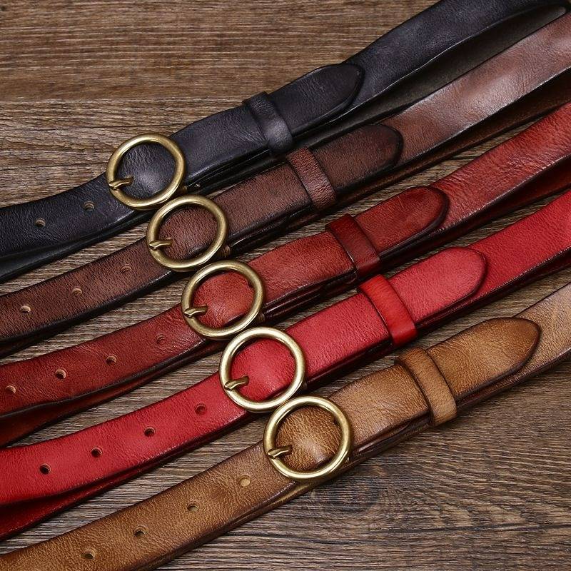 Brown women's vintage round buckle leather belt — coiled