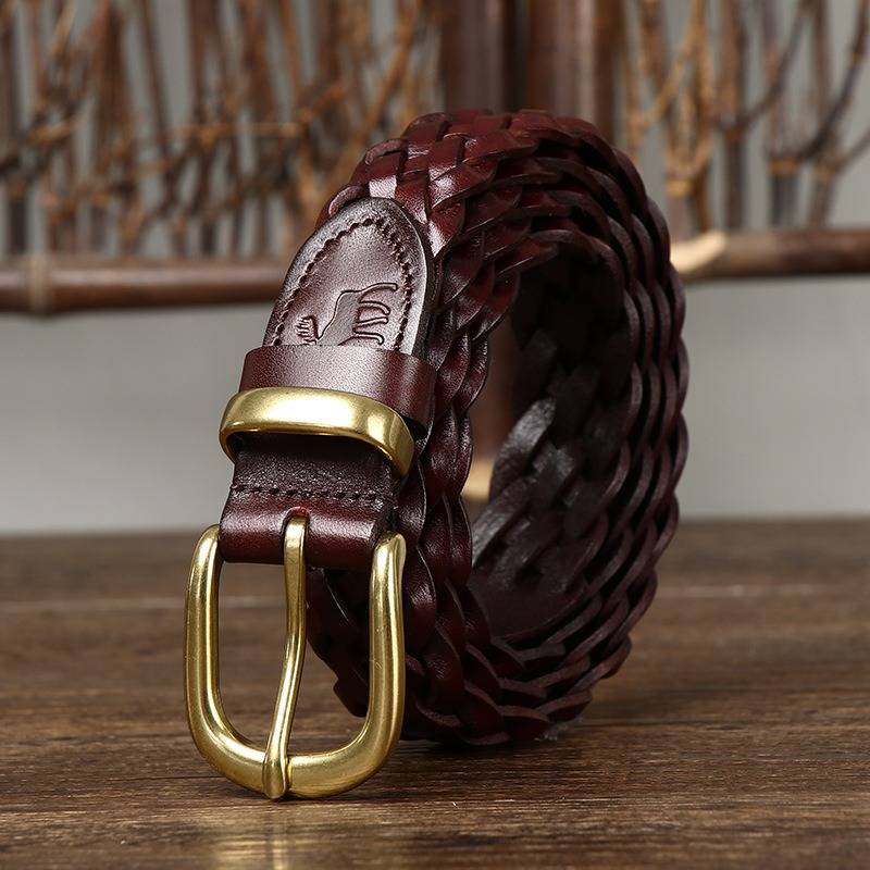 Dark red women's belt, coiled view